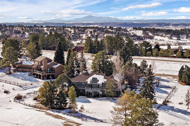 snowy aerial view featuring a mountain view