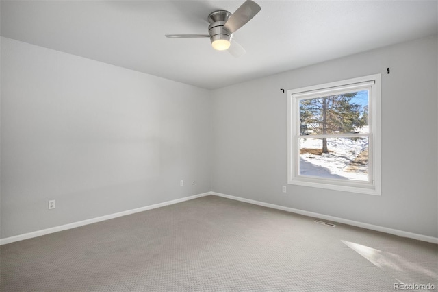 unfurnished room featuring baseboards, carpet, and ceiling fan