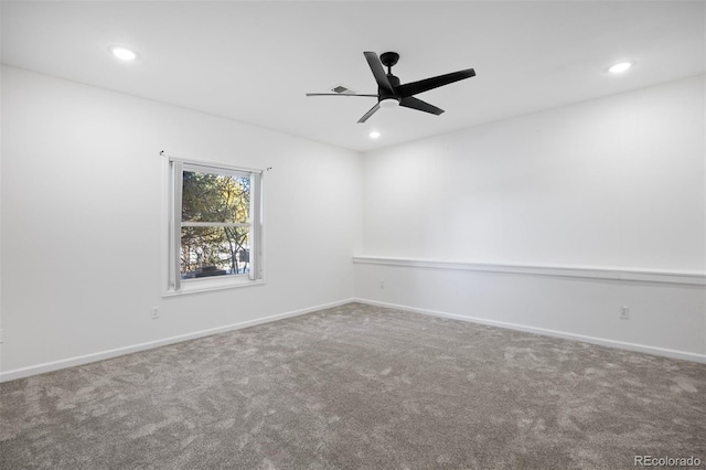 carpeted spare room with recessed lighting, a ceiling fan, and baseboards