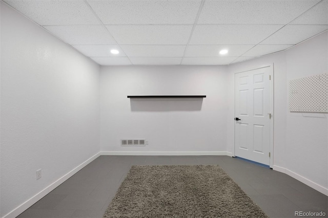 basement with visible vents, recessed lighting, baseboards, and a drop ceiling