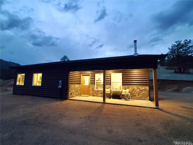 45 Saltlick Cir, Florissant, CO 80816 - back of house with stone siding and faux log siding