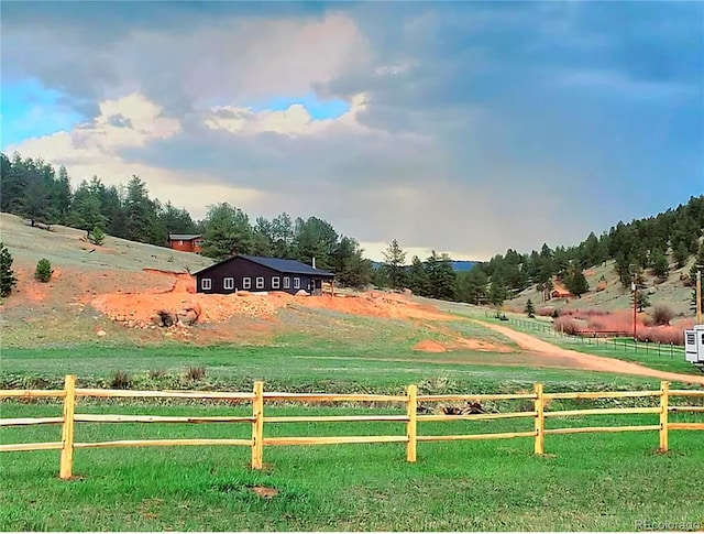 45 Saltlick Cir, Florissant, CO 80816 - view of property's community with a rural view, a lawn, and fence