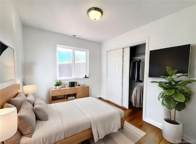 45 Saltlick Cir, Florissant, CO 80816 - bedroom with wood finished floors, visible vents, and a closet