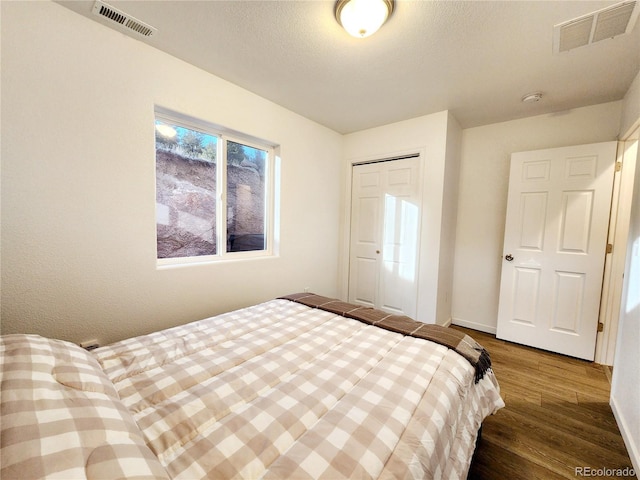 45 Saltlick Cir, Florissant, CO 80816 - bedroom featuring baseboards, wood finished floors, visible vents, and a closet