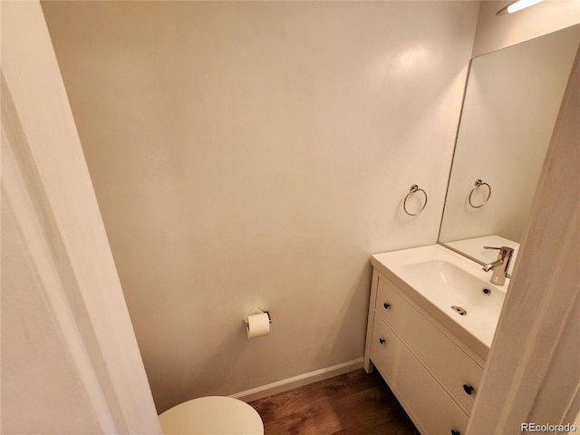 154 Fawn Ct, Silverthorne, CO 80443 - bathroom with vanity, wood finished floors, toilet, and baseboards