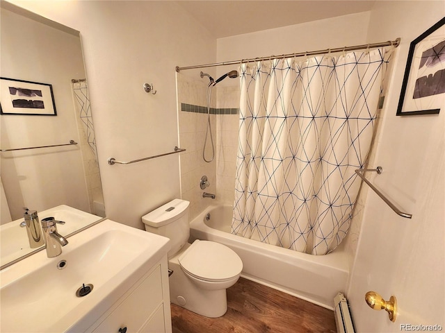 154 Fawn Ct, Silverthorne, CO 80443 - full bathroom with wood finished floors, shower / tub combo with curtain, vanity, baseboard heating, and toilet