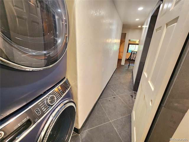154 Fawn Ct, Silverthorne, CO 80443 - washroom featuring stacked washing machine and dryer, tile patterned flooring, and recessed lighting