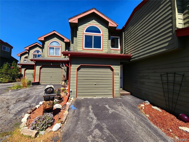 154 Fawn Ct, Silverthorne, CO 80443 - view of front of property with a garage and asphalt driveway