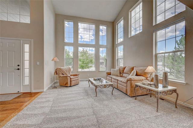 living room with a towering ceiling