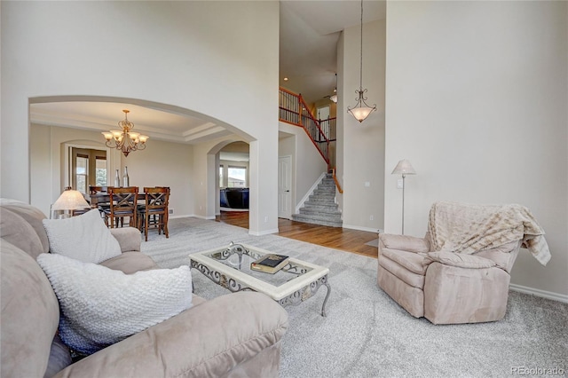 living room featuring hardwood / wood-style floors and an inviting chandelier