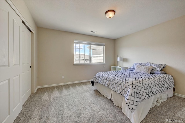 carpeted bedroom with a closet