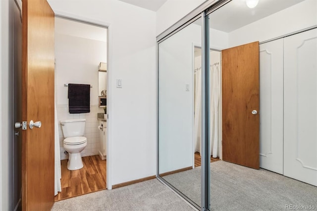 610 S Alton Way Unit 8D, Denver, CO 80247 - bathroom with toilet and tile walls