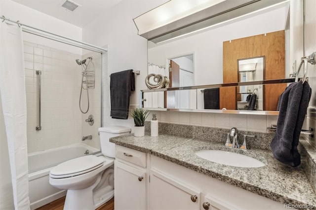 full bathroom with shower / tub combo with curtain, visible vents, toilet, decorative backsplash, and vanity