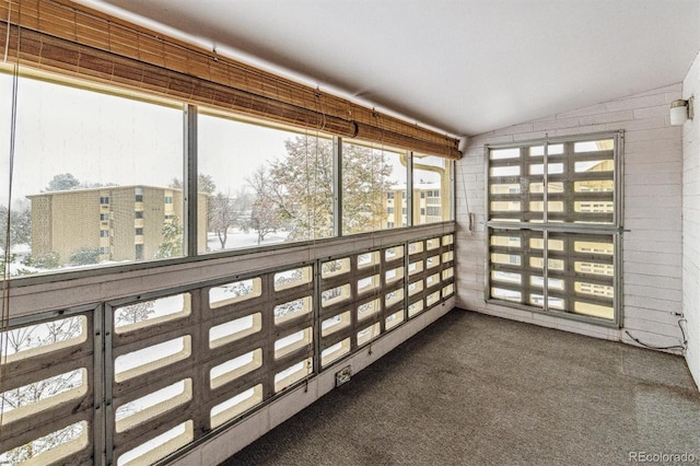 sunroom / solarium with vaulted ceiling