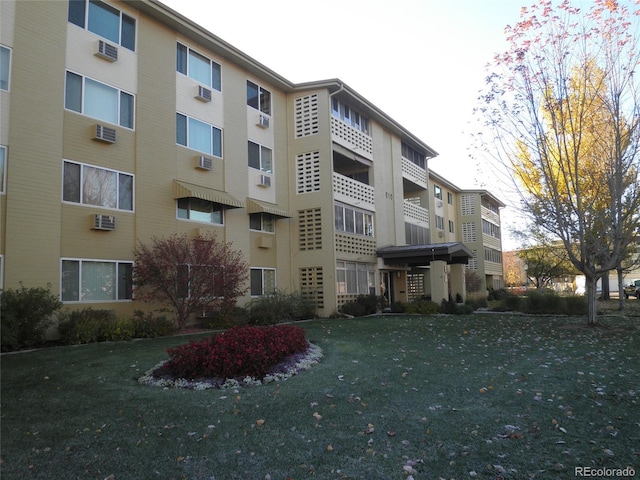 view of property with a wall mounted air conditioner