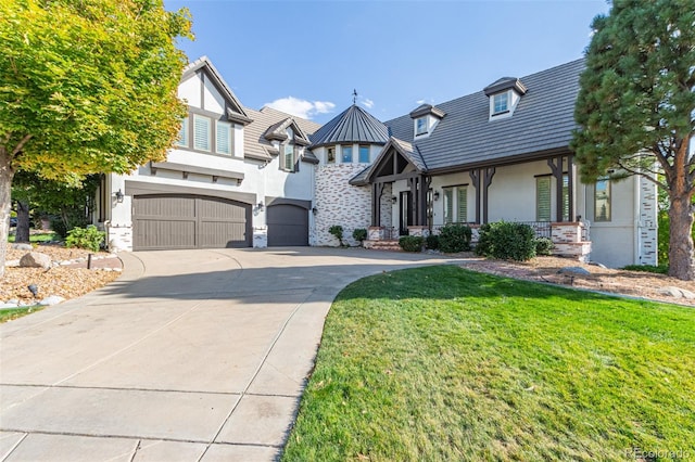 618 Fairchild Dr, Highlands Ranch, CO 80126 - tudor-style house with concrete driveway, stone siding, an attached garage, a front yard, and stucco siding