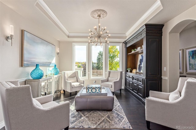 618 Fairchild Dr, Highlands Ranch, CO 80126 - sitting room featuring arched walkways, a tray ceiling, a chandelier, and dark wood-style floors
