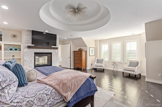 618 Fairchild Dr, Highlands Ranch, CO 80126 - bedroom featuring recessed lighting, wood finished floors, a fireplace, and baseboards