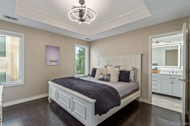 618 Fairchild Dr, Highlands Ranch, CO 80126 - bedroom with visible vents, a sink, a raised ceiling, and crown molding