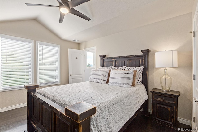 618 Fairchild Dr, Highlands Ranch, CO 80126 - bedroom with lofted ceiling, baseboards, dark wood-style floors, and multiple windows