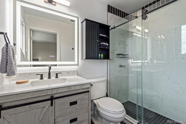 618 Fairchild Dr, Highlands Ranch, CO 80126 - full bath featuring a shower stall, toilet, vanity, and a textured wall