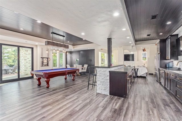 618 Fairchild Dr, Highlands Ranch, CO 80126 - playroom with a sink, a healthy amount of sunlight, visible vents, wood finished floors, and pool table