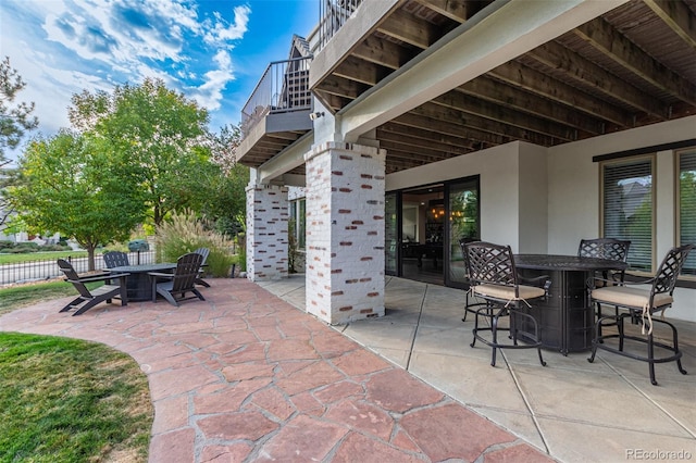 618 Fairchild Dr, Highlands Ranch, CO 80126 - view of patio / terrace featuring a fire pit, a balcony, and outdoor dining space