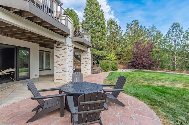 618 Fairchild Dr, Highlands Ranch, CO 80126 - view of patio with stairway, fence, outdoor dining space, and a balcony