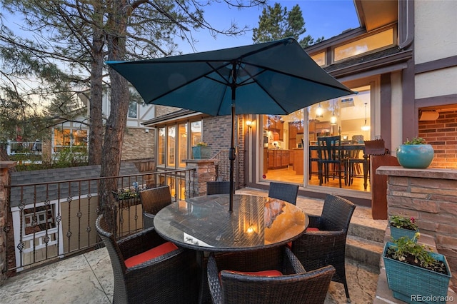 view of patio terrace at dusk