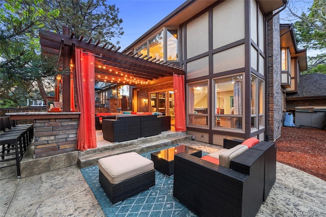 view of patio / terrace featuring exterior bar, a pergola, area for grilling, and outdoor lounge area