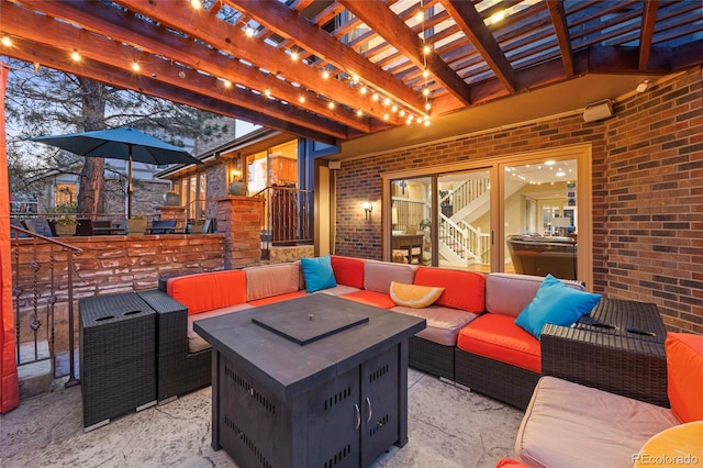 view of patio / terrace featuring an outdoor living space with a fire pit and a pergola