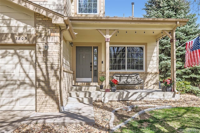 3805 E 106th Ave, Thornton, CO 80233 - doorway to property with covered porch and a garage