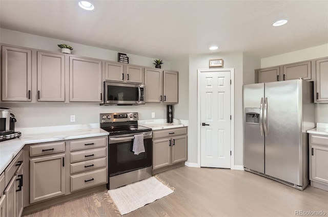 3805 E 106th Ave, Thornton, CO 80233 - kitchen with light countertops, stainless steel appliances, and gray cabinetry