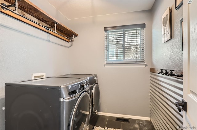 3805 E 106th Ave, Thornton, CO 80233 - clothes washing area featuring washer and clothes dryer, laundry area, baseboards, and tile patterned floors