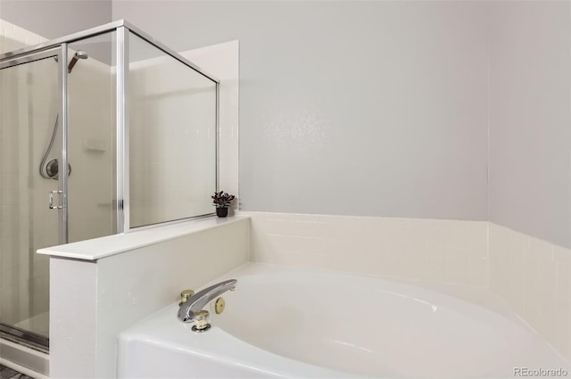 3805 E 106th Ave, Thornton, CO 80233 - bathroom featuring a shower stall and a garden tub