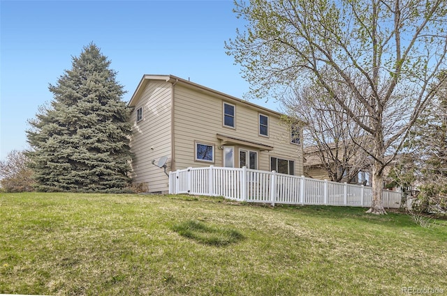 3805 E 106th Ave, Thornton, CO 80233 - rear view of property featuring fence and a lawn