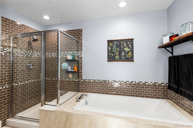 bathroom with shower with separate bathtub