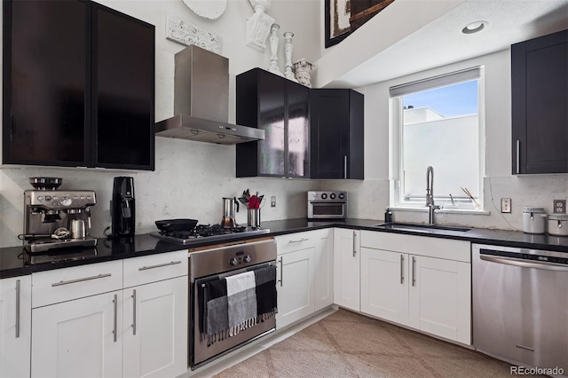 790 N Clarkson St Unit 206, Denver, CO 80218 - kitchen with appliances with stainless steel finishes, wall chimney exhaust hood, a sink, and dark countertops