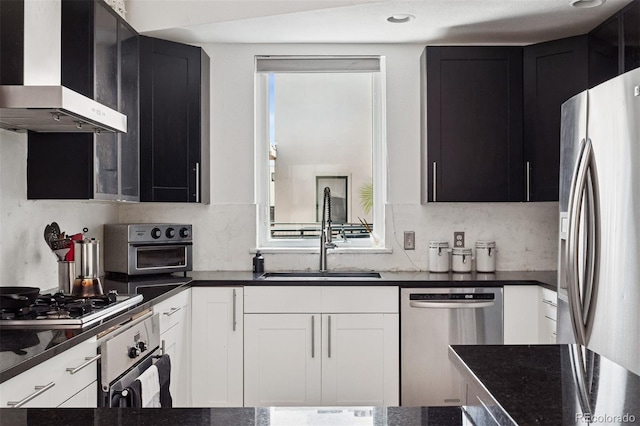 790 N Clarkson St Unit 206, Denver, CO 80218 - kitchen featuring appliances with stainless steel finishes, wall chimney exhaust hood, a sink, and dark cabinetry