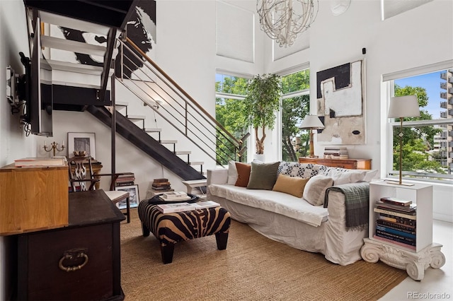 790 N Clarkson St Unit 206, Denver, CO 80218 - living room with a chandelier, stairway, and a towering ceiling