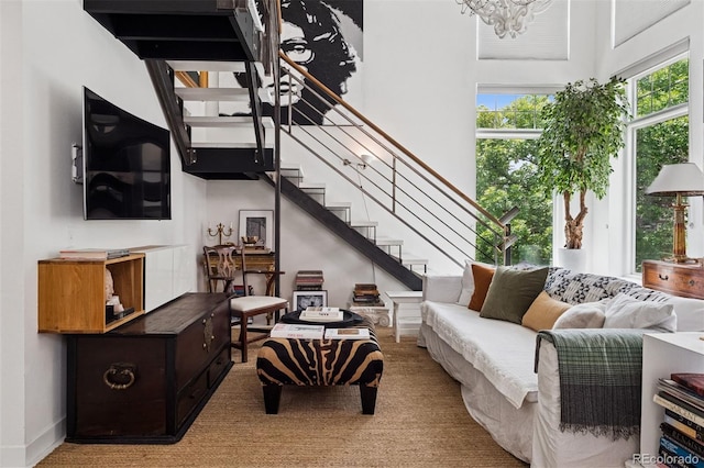 790 N Clarkson St Unit 206, Denver, CO 80218 - living area featuring stairway, carpet, and a chandelier