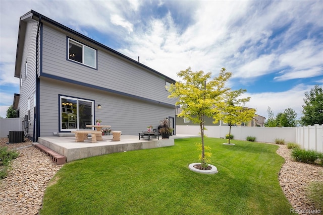 rear view of property with a patio and central AC unit