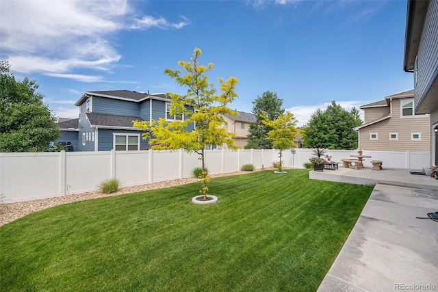 view of yard featuring a patio area and a residential view