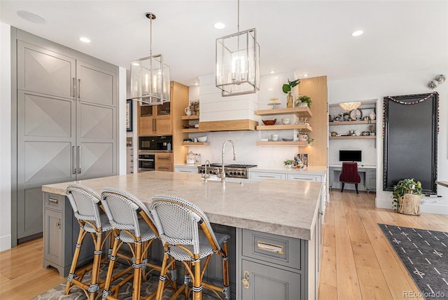 7033 E Lake Cir, Centennial, CO 80111 - kitchen with a sink, open shelves, oven, backsplash, and gray cabinetry