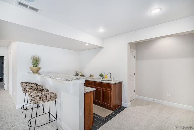 7033 E Lake Cir, Centennial, CO 80111 - bar with indoor wet bar, a sink, visible vents, light colored carpet, and recessed lighting