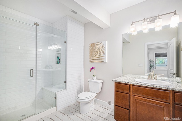 7033 E Lake Cir, Centennial, CO 80111 - full bath featuring toilet, vanity, visible vents, and a stall shower