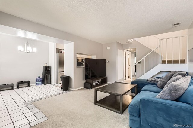2896 W 119th Ave, Westminster, CO 80234 - carpeted living room with stairs, a chandelier, a textured ceiling, and tile patterned flooring