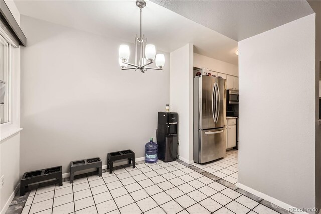 2896 W 119th Ave, Westminster, CO 80234 - unfurnished dining area featuring a chandelier and light tile patterned flooring
