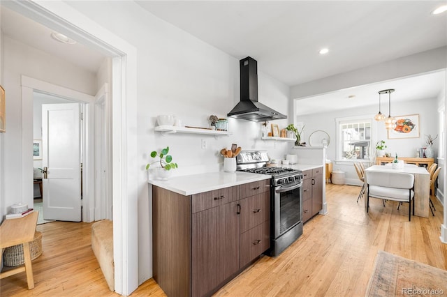 4401 Vrain St, Denver, CO 80212 - kitchen featuring wall chimney range hood, stainless steel range with gas stovetop, open shelves, light countertops, and recessed lighting
