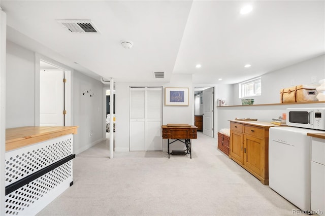 4401 Vrain St, Denver, CO 80212 - kitchen with white microwave, fridge, light carpet, light countertops, and recessed lighting